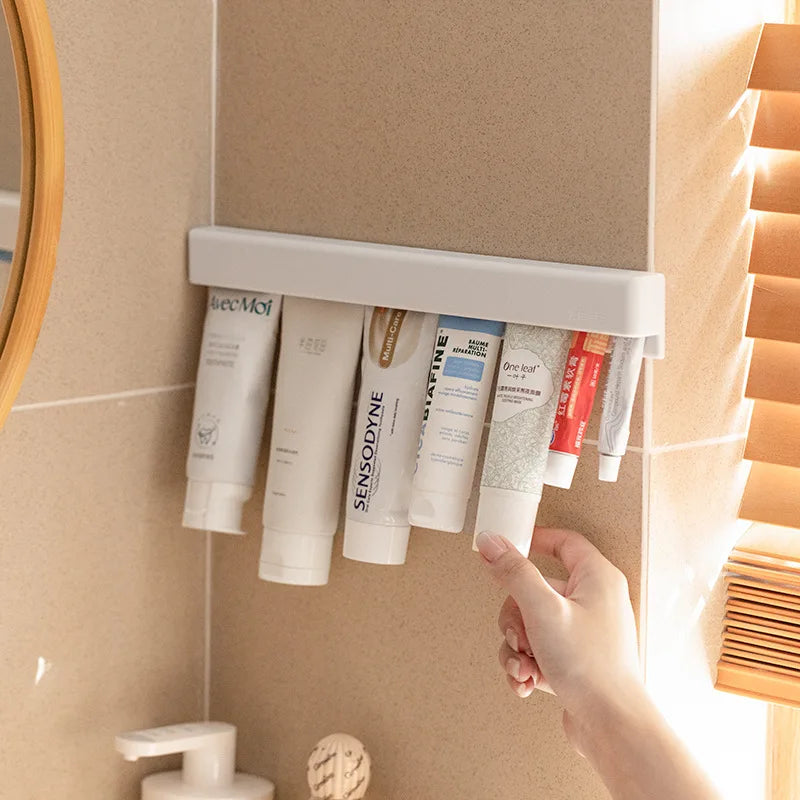 Wall Mounted Toothpaste Holder Self-adhesive Wall Toothpaste Squeezer Facial Cleanser Clip Bathroom Storage Rack Organizer