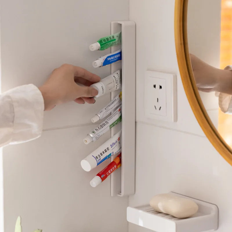 Wall Mounted Toothpaste Holder Self-adhesive Wall Toothpaste Squeezer Facial Cleanser Clip Bathroom Storage Rack Organizer